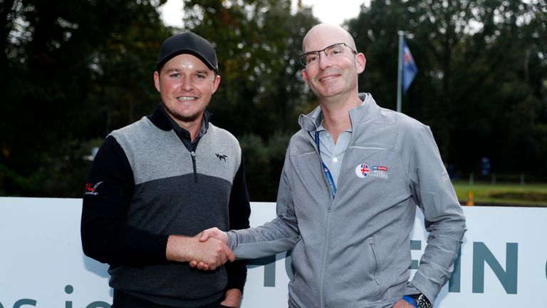 Eddie Pepperell with Luke Chittock, CEO of LIFElabs.io after he scored a hole-in-one during Day One of Sky Sports British Masters at Walton Heath Golf Club on October 11, 2018 in Tadworth, England.
