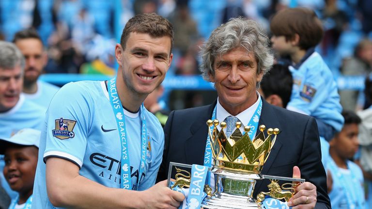 Edin Dzeko and Manuel Pellegrini pose with Premier League trophy