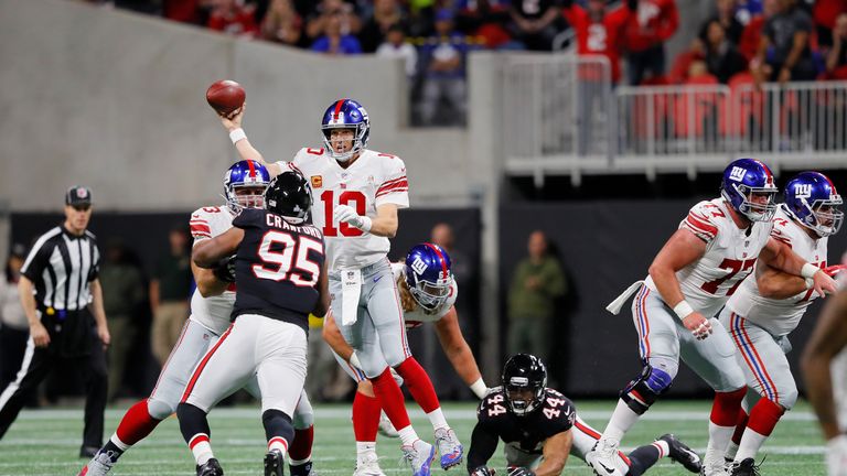 Eli Manning #10 of the New York Giants passes the ball during the second quarter against the Atlanta Falcons at Mercedes-Benz Stadium on October 22, 2018 in Atlanta, Georgia. 