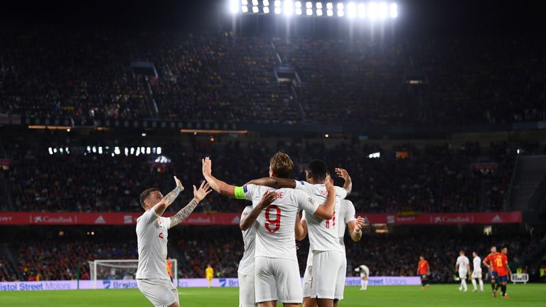 England players celebrate going 2-0 up in Spain