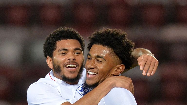 Reiss Nelson of England U21 celebrates with teammate Jay DaSilva after scoring his team's first goal against Scotland