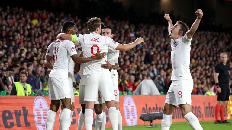 England's Raheem Sterling (obscured) celebrates scoring his England's first goal of the game during the Nations League match against Spain