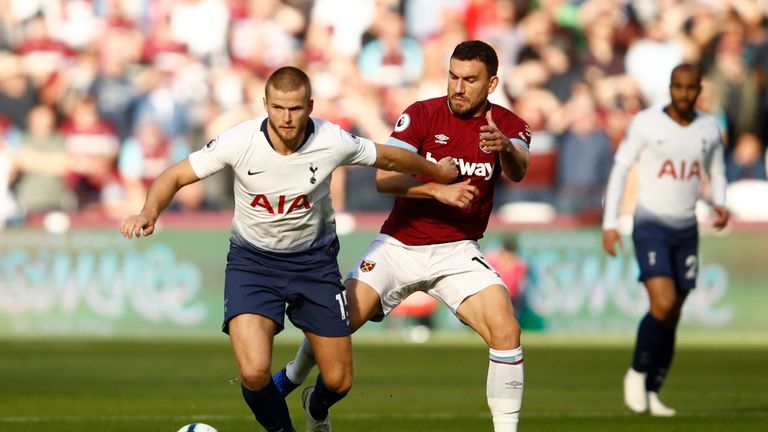 Eric Dier breaks forward under pressure from Robert Snodgrass