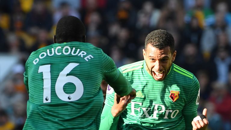 Etienne Capoue celebrates with Abdoulaye Doucoure after scoring his team's first goal 