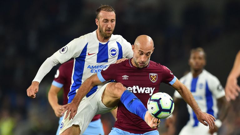 Brighton's English striker Glenn Murray (L) vies with West Ham United's Argentinian defender Pablo Zabaleta during the English Premier League football match between Brighton and Hove Albion and West Ham at the American Express Community Stadium in Brighton, southern England on October 5, 2018. 