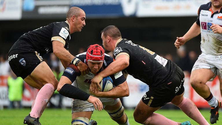 Edinburgh's Grant Gilchrist is double tackled in a show of resilience by Montpellier