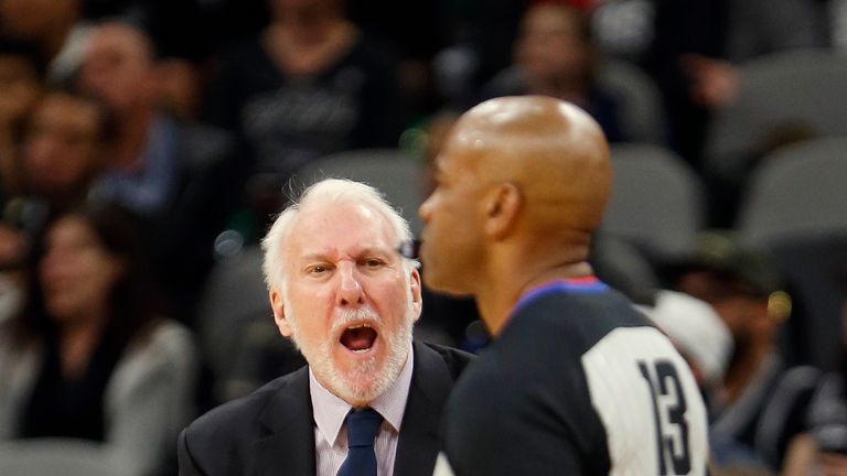 San Antonio Spurs head coach Gregg Popovich shouts in the direction of NBA official Tre Maddox after a travel was not called