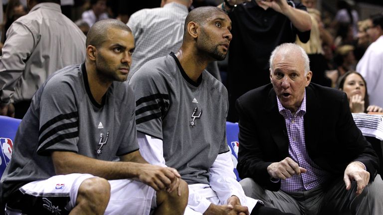 Head coach Gregg Popovich of the San Antonio Spurs talks to Tim Duncan #21 and Tony Parker #9 on the bench in the third quarter while taking on the Oklahoma City Thunder in Game Two of the Western Conference Finals of the 2012 NBA Playoffs at AT&T Center on May 29, 2012 in San Antonio, Texas