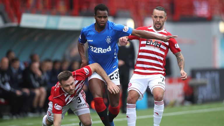 Scott McMann of Hamilton Academical vies with Lassana Coulibaly of Rangers