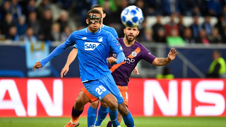 Hoffenheim's German defender Kevin Akpoguma (L) and Manchester City's Argentinian striker Sergio Aguero vie for the ball during the UEFA Champions League group F football match between TSG 1899 Hoffenheim and Manchester City at the Rhein-Neckar-Arena in Sinsheim, southwestern Germany, on October 2, 2018