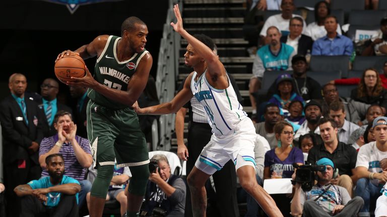 Khris Middleton #22 of the Milwaukee Bucks handles the ball against the Charlotte Hornets during a game on October 17, 2018 at Spectrum Center, in Charlotte, North Carolina.