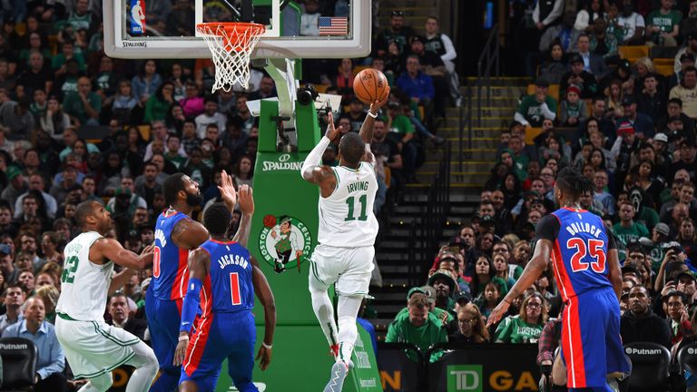 Kyrie Irving #11 of the Boston Celtics drives to the basket and shoots the ball against the Detroit Pistons on October 30, 2018 at the TD Garden in Boston, Massachusetts.