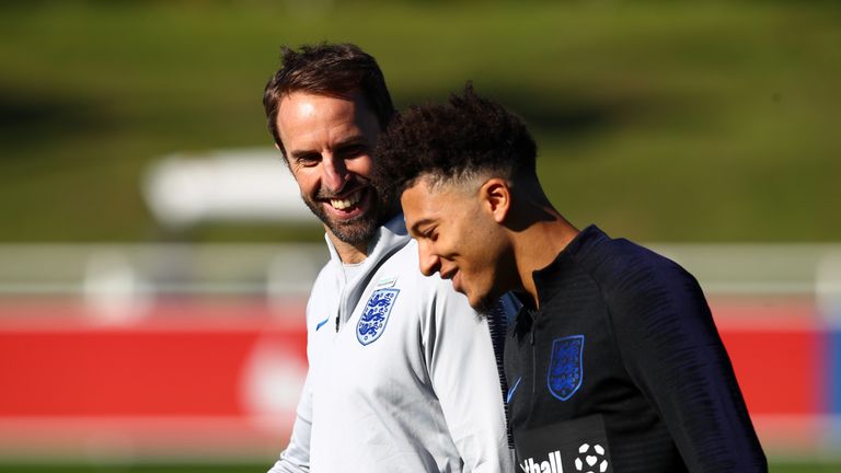 Jadon Sancho with Gareth Southgate during an England Training Session at St Georges Park on October 9, 2018 in Burton-upon-Trent, England.
