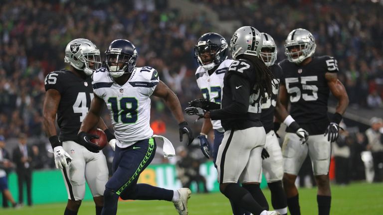 Jaron Brown of the Seattle Seahawks scores a touch down uring the NFL International Series game between Seattle Seahawks and Oakland Raiders at Wembley Stadium on October 14, 2018 