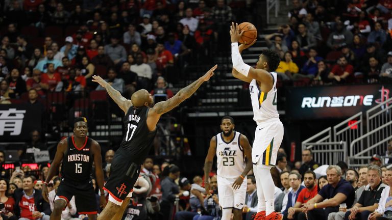 Donovan Mitchell #45 of the Utah Jazz takes a three point shot defended by PJ Tucker #17 of the Houston Rockets in the second half at Toyota Center on October 24, 2018 in Houston, Texas.