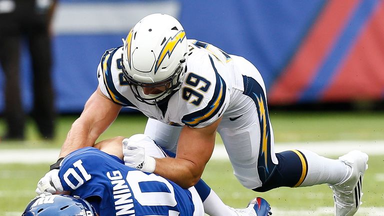 EAST RUTHERFORD, NJ - OCTOBER 08:  Joey Bosa #99 of the Los Angeles Chargers sacks Eli Manning #10 of the New York Giants during their game at MetLife Stadium on October 8, 2017 in East Rutherford, New Jersey. (Photo by Jeff Zelevansky/Getty Images)