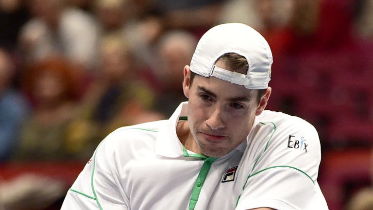 US John Isner returns the ball to Britain's Cameron Norrie during their tennis match at the Vienna Open ATP tournament on October 23, 2018 in Vienna.