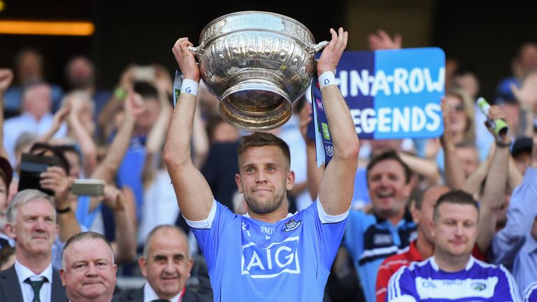 Jonny Cooper hoists the Delaney Cup, as Dublin won the provincial title for an eighth consecutive year