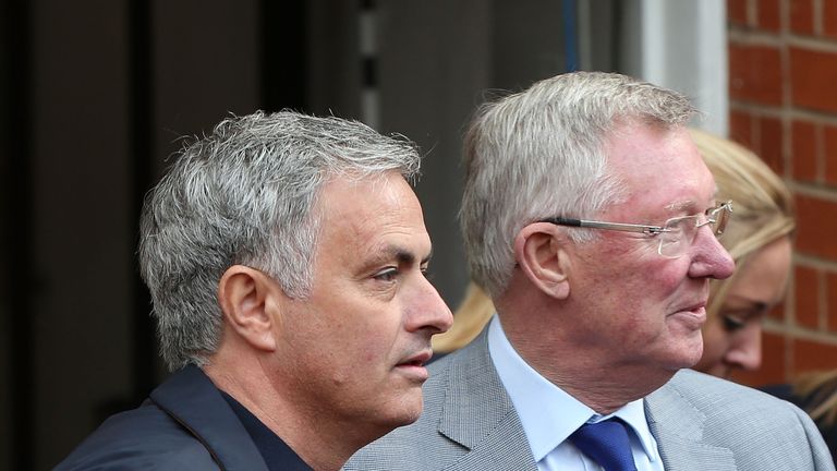 Manager Jose Mourinho and Former Manager Sir Alex Ferguson of Manchester United wait to greet Manager Arsene Wenger of Arsenal ahead of the Premier League match between Manchester United and Arsenal at Old Trafford on April 29, 2018 in Manchester, England.