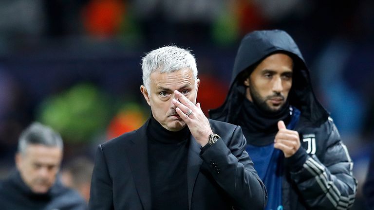 Jose Mourinho walks off the pitch at Old Trafford