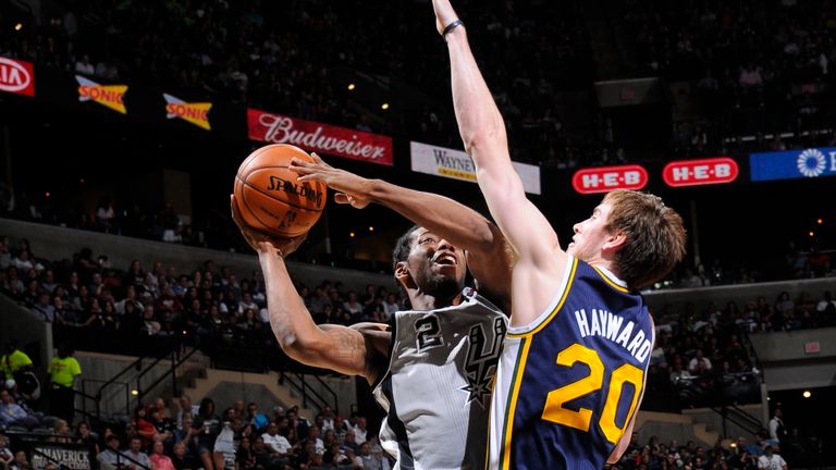 Kawhi Leonard #2 of the San Antonio Spurs goes to the basket against Gordon Hayward #20 of the Utah Jazz during the game between the Utah Jazz and the San Antonio Spurs on November 3, 2012 at the AT&T Center in San Antonio, Texas