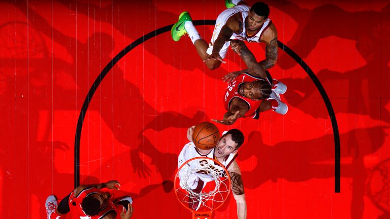 Kevin Love of the Cleveland Cavaliers and Kawhi Leonard #2 of the Toronto Raptors go for a rebound on October 17, 2018 at Scotiabank Arena in Toronto, Ontario, Canada