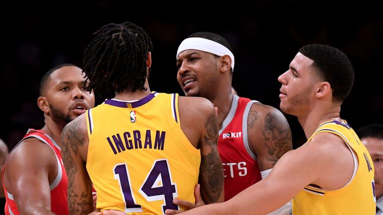 The Lakers' Brandon Ingram  had to be restrained during ugly scenes on court in the final quarter of their defeat to the Houston Rockets
