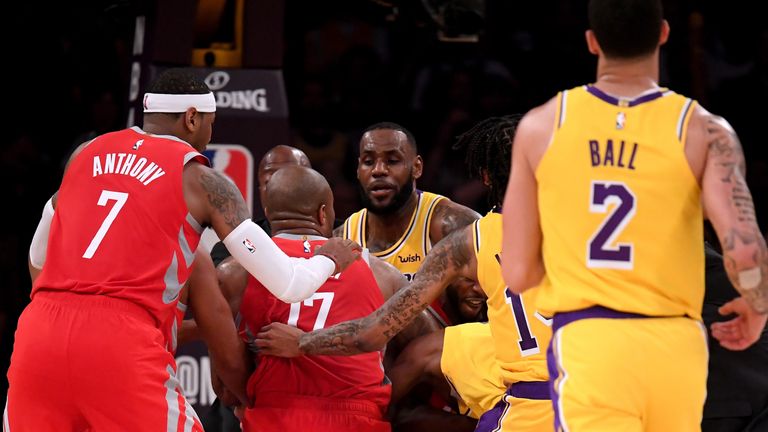 Chris Paul #3 of the Houston Rockets and Rajon Rondo #9 of the Los Angeles Lakers fight during a 124-115 Rockets win at Staples Center on October 20, 2018 in Los Angeles, California.
