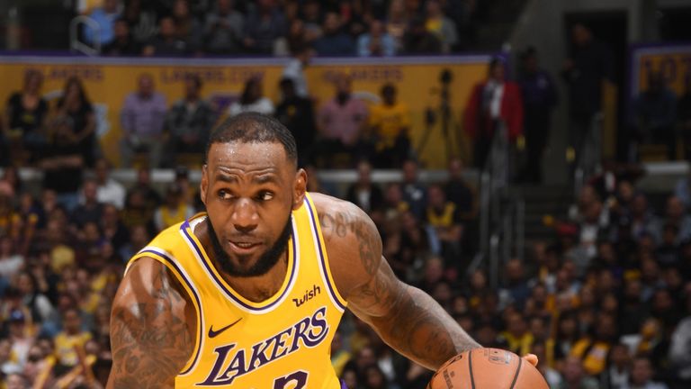 LeBron James drives to the basket during game against the San Antonio Spurs at the STAPLES Center