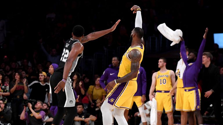 OCTOBER 22: LeBron James #23 of the Los Angeles Lakers makes a three pointer in front of Rudy Gay #22 of the San Antonio Spurs to tie the game 128-128 during a 143-142 overtime Laker loss at Staples Center on October 22, 2018 in Los Angeles, California.