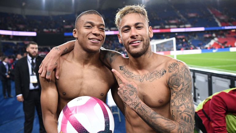 Brazilian forward Neymar (R) and Paris Saint-Germain's French forward Kylian Mbappe celebrate at the end of the French L1 football match between Paris Saint-Germain (PSG) and Olympique de Lyon (OL) on October 7, 2018