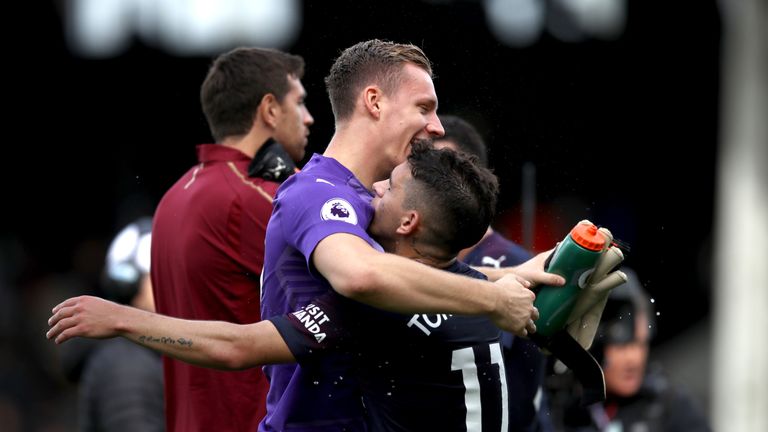 Lucas Torreira celebrates with Bernd Leno against Fulham