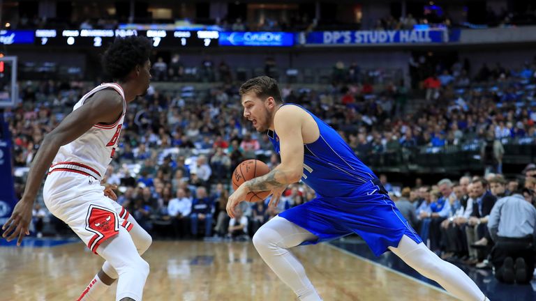 Luka Doncic #77 of the Dallas Mavericks drives to the basket against Justin Holiday #7 of the Chicago Bulls at American Airlines Center on October 22, 2018 in Dallas, Texas