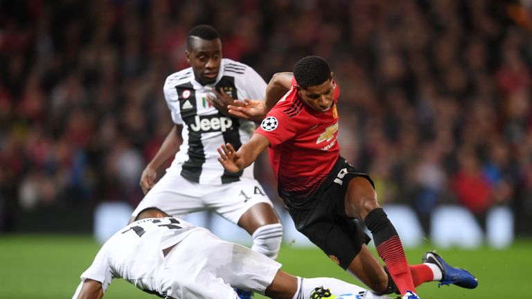 Manchester United's Marcus Rashford is challenged by Juventus' 	Blaise Matuidi