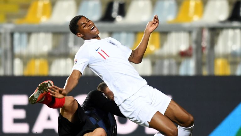 Marcus Rashford is brought down by Mateo Kovacic