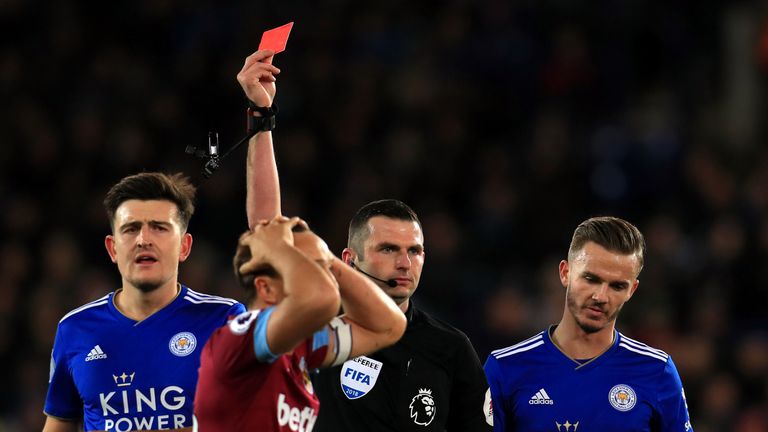 West Ham United's Mark Noble is shown a red card by referee Michael Oliver