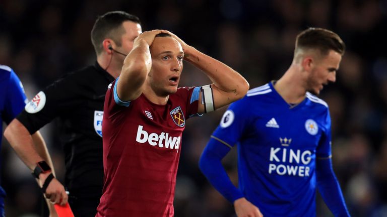 West Ham United's Mark Noble reacts to being shown a red card by referee Michael Oliver