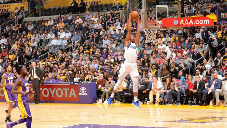  Dennis Smith Jr. #1 of the Dallas Mavericks dunks the ball during the game against the Los Angeles Lakers on March 28, 2018 at STAPLES Center in Los Angeles, California.