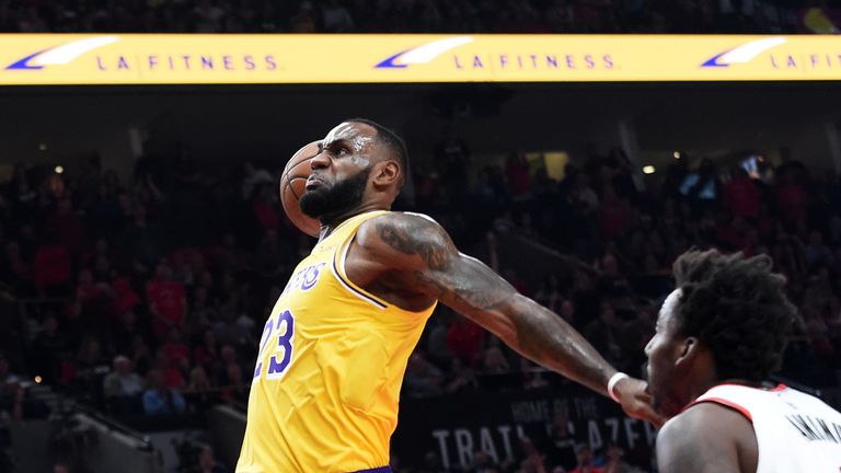 LeBron James #23 of the Los Angeles Lakers dunks against the Portland Trail Blazers in the first quarter of their game at Moda Center on October 18, 2018 in Portland, Oregon