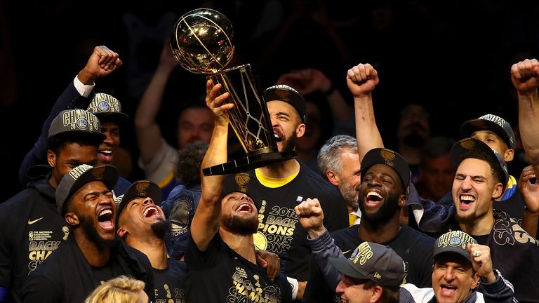 The Golden State Warriors celebrate with the Larry O&#39;Brien Trophy after defeating the Cleveland Cavaliers in Game Four of the 2018 NBA Finals at Quicken Loans Arena on June 8, 2018 in Cleveland, Ohio