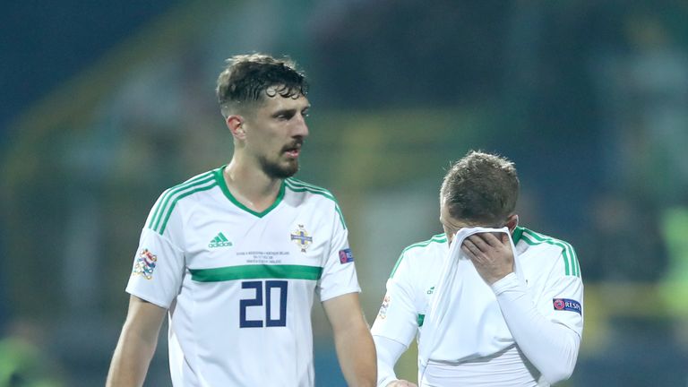 Northern Ireland's Craig Cathcart (left) and Steven Davis react to Bosnia taking the lead