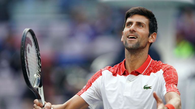 Novak Djokovic of Serbia celebrates after defeating Marco Cecchinato of Italy in their men's singles third round match at the Shanghai Masters tennis tournament on October 11, 2018. 