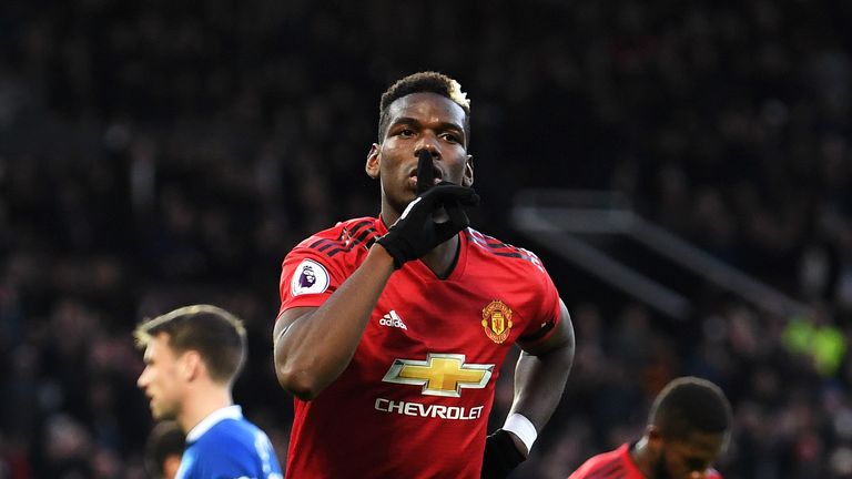 Paul Pogba wheels away in celebration after scoring from the penalty spot