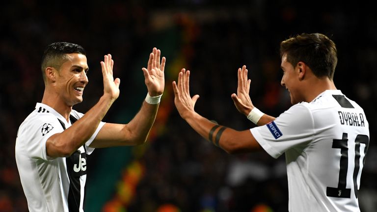 Paulo Dybala celebrates scoring Juventus' first goal with team-mate Cristiano Ronaldo