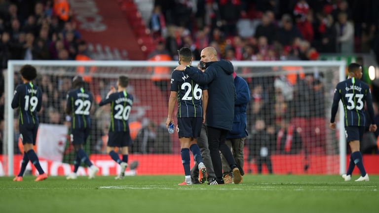 Pep Guardiola puts his arm around Riyad Mahrez as they leave the pitch