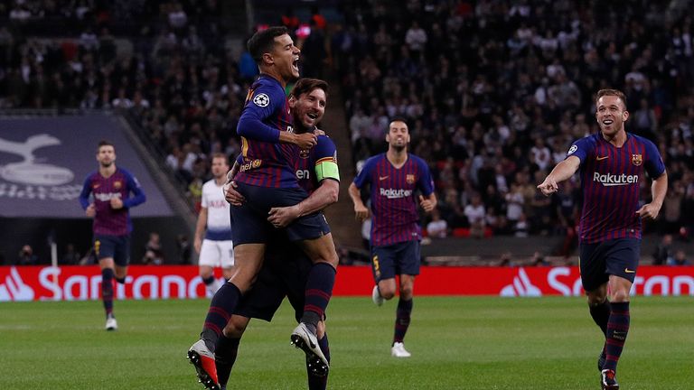 Philippe Coutinho celebrates scoring against Spurs with Lionel Messi