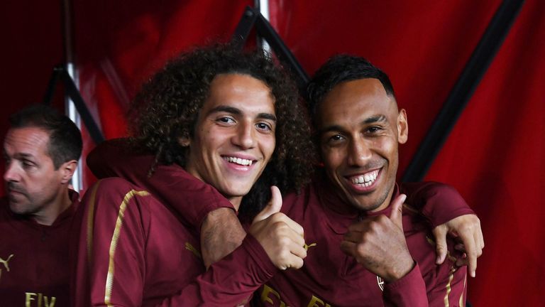 Pierre-Emerick Aubameyang and Matteo Guendouzi give the thumbs up before the Premier League match between Arsenal and Leicester City