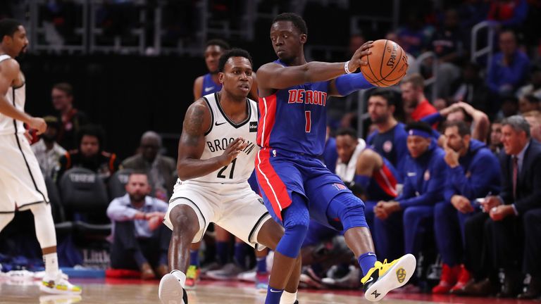 Reggie Jackson #1 of the Detroit Pistons controls the ball in front of Treveon Graham #21 of the Brooklyn Nets in the second half during the home opener at Little Caesars Arena on October 17, 2018 in Detroit, Michigan