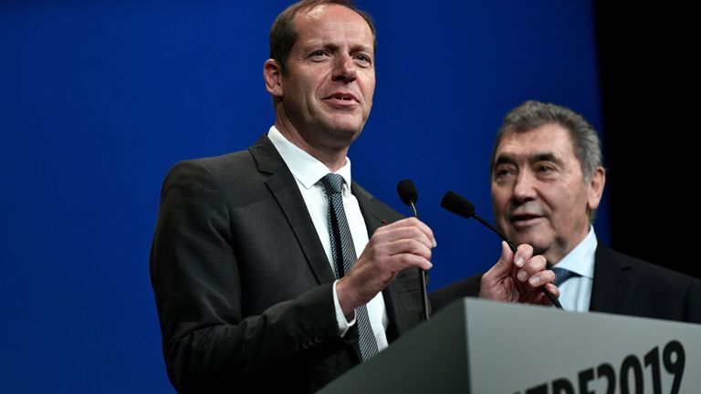 General Director of the Tour de France, France's Christian Prudhomme (L), flanked by five-time Tour de France winner, Belgium's Eddy Merckx