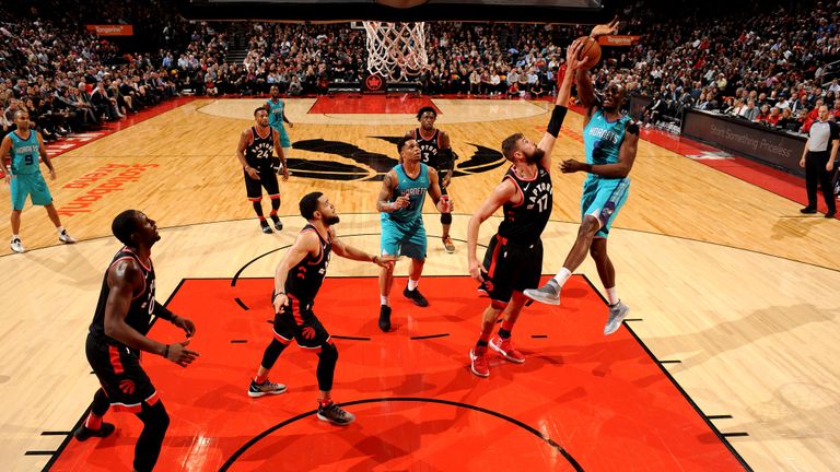 Jonas Valanciunas #17 of the Toronto Raptors block the shot from Bismack Biyombo #8 of the Charlotte Hornets on October 22, 2018 at the Scotiabank Arena in Toronto, Ontario, Canada.